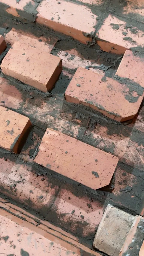 Fresh brickwork of a heating stove ash pit and bench. Smoke channels of the.. Stock Footage 325622127