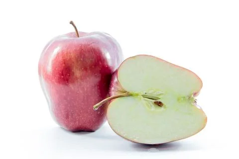 Fresh bright red apple half sliced with raw Stock Photos