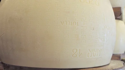 Fresh, bright, young Parmesan lying on the shelf Video stock 89989501