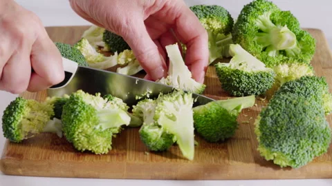 Fresh broccoli being cut into florets for cooking. Video stock 331145268