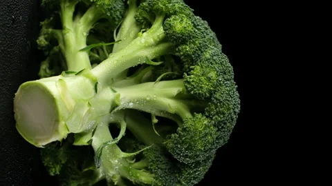 Fresh broccoli close up on black background, rotate. vertical video Stock Footage 149903597