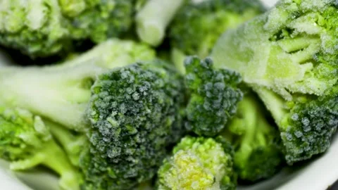 Fresh broccoli florets arranged on a plate, ideal for food Stock Footage 345168531