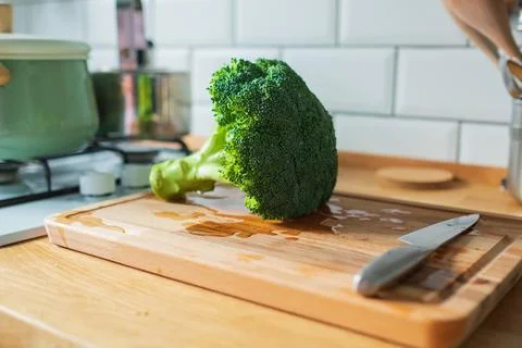 Fresh broccoli isolated on a kitchen table Stock Photos