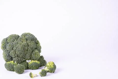 Fresh broccoli lies on a table Stock Photos
