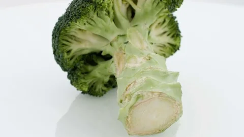 Fresh Broccoli on Turntable - Wet Stock Footage 75744709