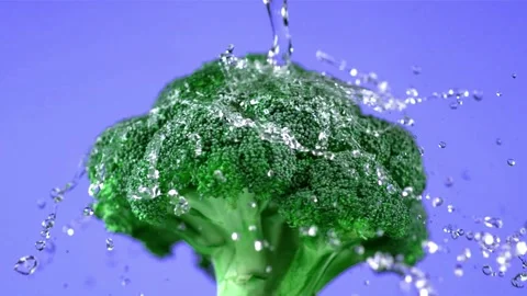 Fresh broccoli vegetable being washed with clean water splash Stock Footage 327573471
