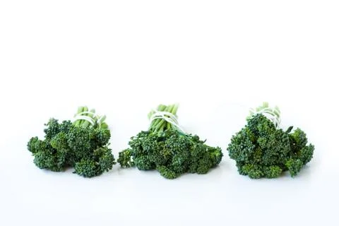 Fresh broccolini isolated on white background with copy space. Stock Photos