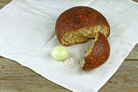 Fresh broken loaf of peasant bread Stock Photos