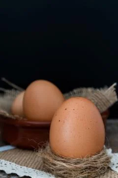Fresh brown eggs on a rustic table Stock Photos
