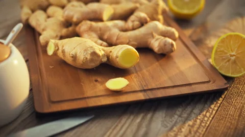 Fresh brown ginger roots packed with vitamins and healing properties lie on Stock Footage 331351025
