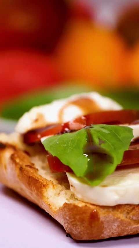 Fresh Bruschetta Appetizer with Tomatoes, Basil, and Mozzarella Stock Footage 281967047