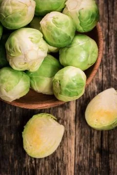 Fresh brussel sprouts over rustic wooden texture.healthy food Stock Photos