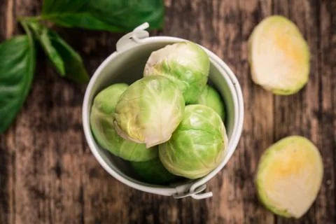 Fresh brussel sprouts over rustic wooden texture.healthy food Stock Photos
