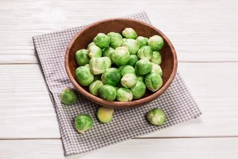 Fresh brussel sprouts over rustic wooden texture.healthy food Stock Photos