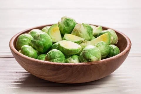 Fresh brussel sprouts over rustic wooden texture.healthy food Stock Photos