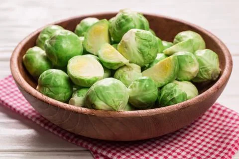 Fresh brussel sprouts over rustic wooden texture.healthy food Stock Photos