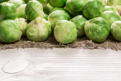Fresh brussel sprouts over rustic wooden texture.healthy food Stock Photos