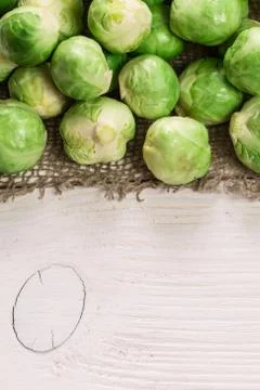 Fresh brussel sprouts over rustic wooden texture.healthy food Stock Photos