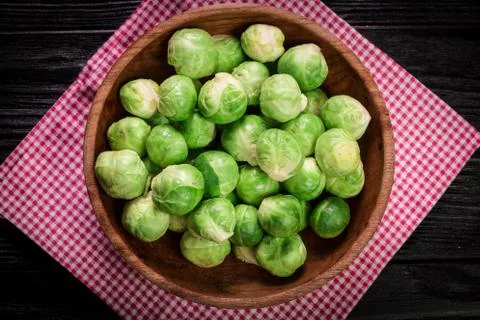 Fresh brussel sprouts over rustic wooden texture.healthy food Stock Photos