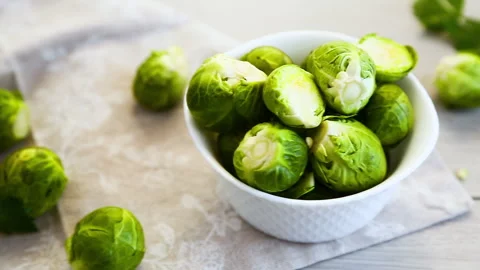 Fresh brussels sprouts composition with copy space on green background Stock Footage 330951142