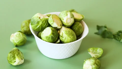Fresh brussels sprouts composition with copy space on green background Stock Footage 330951146