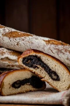 Fresh bun, sliced bun. Bread on a brown background. Rural food. Homemade past Stock Photos