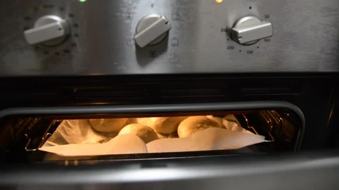 Fresh buns from the oven. Conveyor with bread. Baking bread. Workshop for produc 動画素材 98422209
