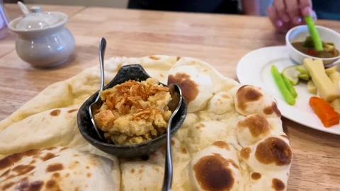 Fresh Burmese Naan Flatbread Served with Chickpea Mash Stock Footage 346937678