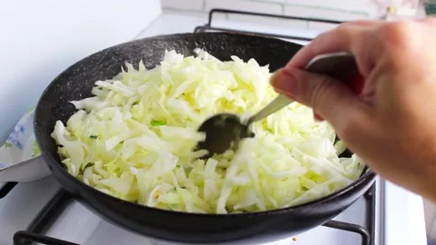 Fresh cabbage is stewed in a pan. Stock Footage 137262965