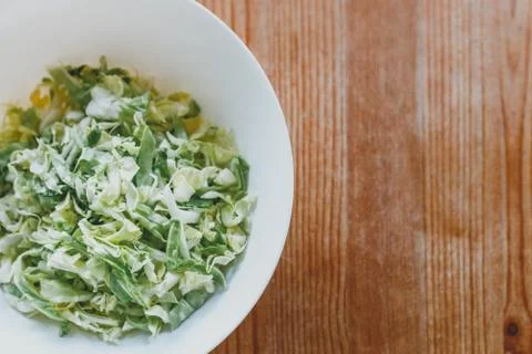 Fresh cabbage top view on a wooden table. juicy white cabbage salad on a whit Stock Photos
