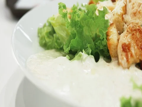 Fresh Caesar salad with chicken, vegetables, eggs and chopped lettuce. 4k UHD Stock Footage 78193710