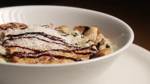 Fresh Caesar salad with grilled chicken, parmesan, and croutons Stock Footage 336743409