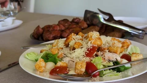 Fresh caesar salad with grilled meat and barbecue sauce Stock Footage 336743201