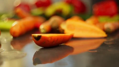 Fresh Carrot in Slow Motion Falling on Table Stock Footage 296362801