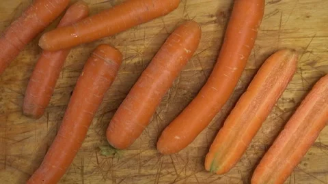 Fresh carrots on a cutting board. Stock Footage 168560735
