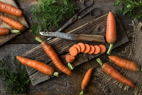 Fresh carrots on rustic  background with copy space Stock Photos