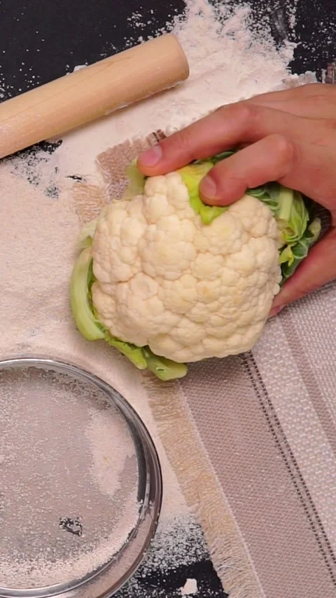 Fresh Cauliflower Head with Flour and Sieve on Kitchen Table Top View Stock Footage 346639874