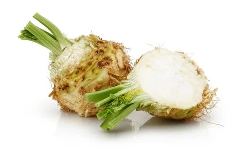 Fresh celeriac root with slice isolated Stock Photos