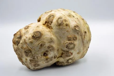 Fresh celery root vegetable closeup on white. Stock Photos