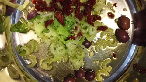 Fresh Celery Salad With Olives, Sun-Dried Tomatoes And Olive Oil Stock Footage 333844927
