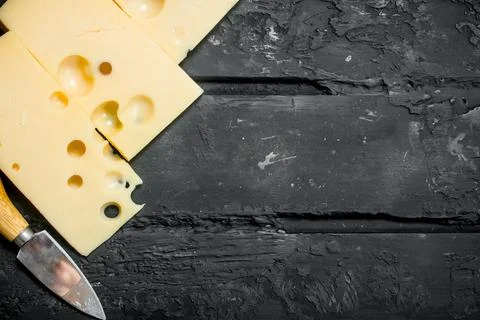 Fresh cheese with knife. Stock Photos