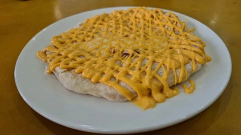 Fresh cheese naan with extra melted cheese inside and on top Stock Footage 334560388