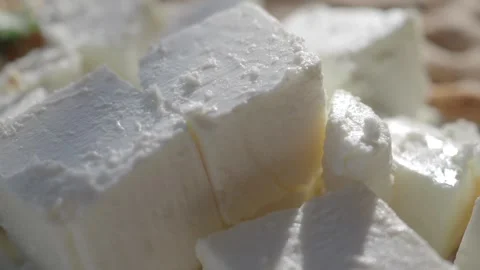 Fresh cheese preparation process captured in sunlight Stock Footage 318940753
