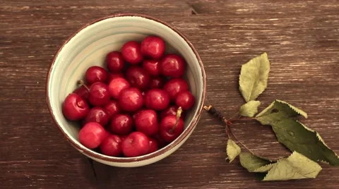 Fresh cherries in bowl on table Stock-Footage 64745659