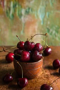 Fresh cherries in a ceramic cup. Stock Photos