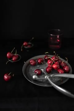 Fresh Cherries with Cherry Pitter Stock Photos