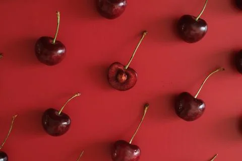 Fresh cherries on red background flat lay 写真素材