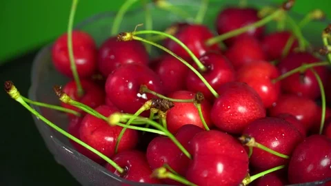 Fresh cherries rotating in plate Stock Footage 76466106