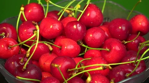 Fresh cherries rotating in plate Stock-Footage 76466182