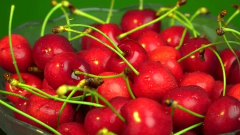 Fresh cherries rotating in plate Stock Footage 76466309